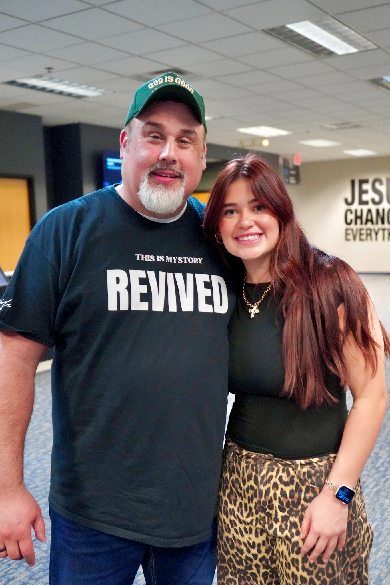 Two people smiling together in the Bethesda Welcome Center.