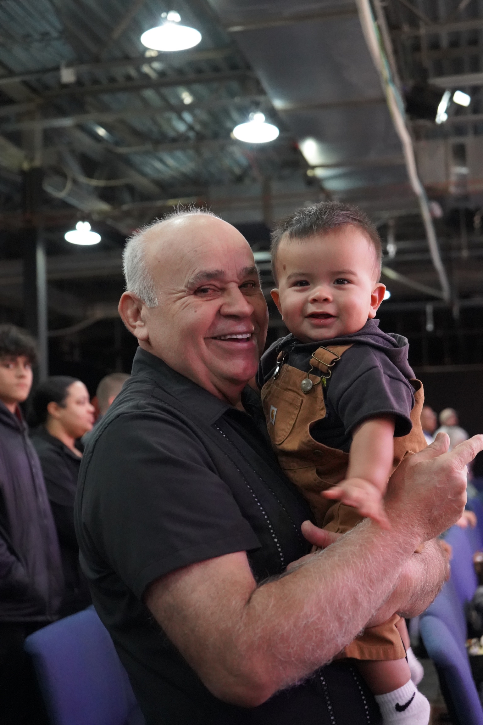 A smiling adult holding a young child at Bethesda.